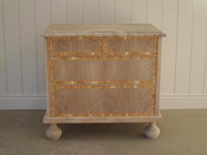 The first chest of drawers is typical of small four-drawer William and Mary chests made around 1695. The carcase is made of pine and veneered with walnut, and the drawer fronts are additionally crossbanded with yew. Jack Plane.