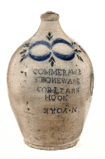 Stoneware jug with ornament and lettering in blue glaze, 'COMMERAWS STONEWARE. . .'